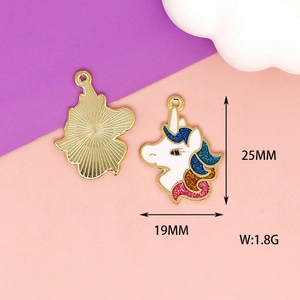 Detail view of unicorn enamel charm showing size 25x19mm and polished gold backside