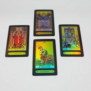 Detail of tarot cards featuring The Hierophant and Lovers with gold laser finish