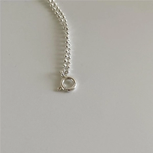 Detail of 925 sterling silver beaded bracelet with S925 hallmark and spring ring clasp