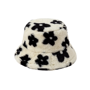 Thick plush bucket hat with floral pattern in cream and black for autumn winter season