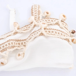 Bohemian white tassel top with seashell and bead details for summer island vacations