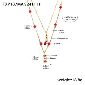 Detail view of a double-layer stainless steel necklace with garnet beads and candy pendant