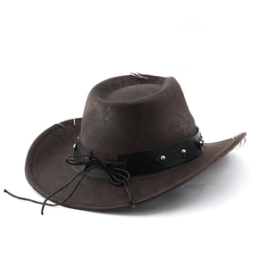 Detail view of dark brown western cowboy hat with silver studs and metal ring accents