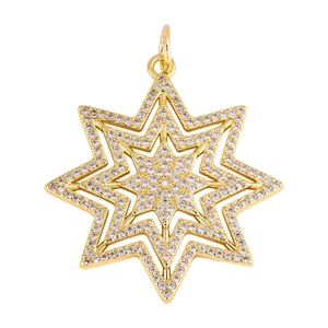 Macro shot of gold star pendant with cubic zirconia inlay and layered octagonal structure