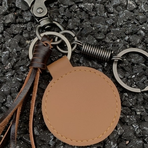 Vintage American braided leather keychain with brown leather fringe and gunmetal rings