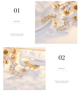 Macro detail of C-shaped gold earrings with baguette-cut zircons and stud closure