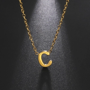 Detailed view of a gold stainless steel necklace with a polished capital letter C pendant