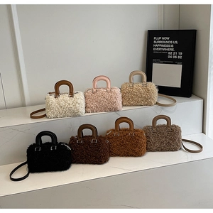 Detailed close-up showing soft faux shearling box handbags in a variety of vibrant colors