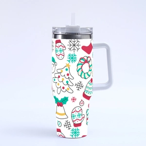 Christmas 40oz tumbler with handle and straw featuring festive holiday patterns