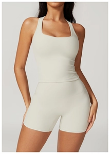 Detail of cream brushed sports vest and high-waist shorts set showing soft fabric texture