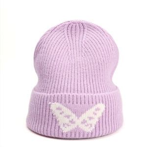 Detail of light purple knit beanie with white butterfly jacquard on the fold-over cuff