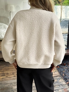 Rear view of white faux shearling jacket with casual button design for winter