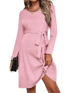 Elegant pink knit maternity dress with long sleeves, A-line cut, and adjustable waist tie