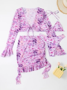 Flat lay of purple floral 4-piece bikini set with flare sleeve cover-up and skirt