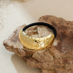 Irregular gold metallic hair tie with embossed texture and black elastic band for women