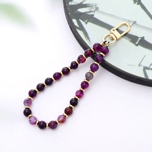 Detail of purple agate beaded lanyard with gold metal spacer beads and lobster clasp