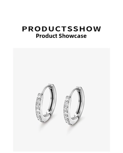 Detailed close-up of S999 sterling silver hoop earrings with white zircon claw setting