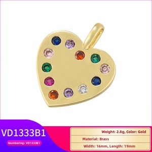 Detailed view of golden brass heart pendant featuring vibrant colorful zircon stone inlay