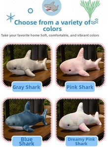 Detail view of colorful plush shark toys in gray, pink, blue and gradient colors