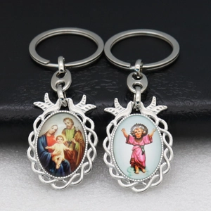 Religious silver keychains with Holy Family and Child Jesus in woven frames