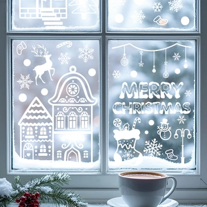 White Christmas window decals featuring reindeers snowflakes and Merry Christmas text