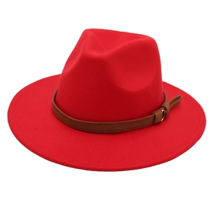 Detail view of red wool felt fedora with a brown leather belt buckle hatband decoration