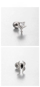 Detailed tile display of heart scepter and spider earrings with zircon inlay