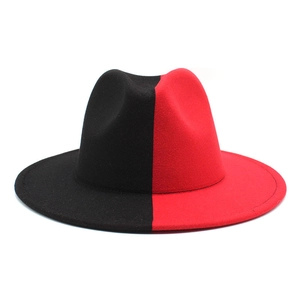 Detailed top view of the black and red two-tone patchwork felt fedora hat with flat brim