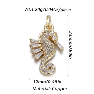 Golden copper seahorse pendant with clear cubic zirconia showing 23x12mm dimensions