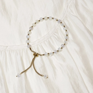 Detail of 18K gold plated bead bracelet featuring aurora-cut iridescent crystals