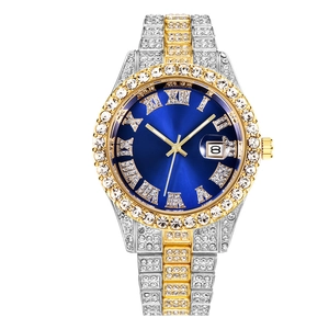 Close-up of blue dial men's steel watch with diamond-set bezel and date magnifier