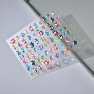 Macro shot of 5D Under the Sea nail stickers with colorful 3D crab and dolphin patterns