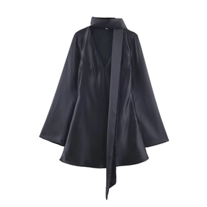 Elegant black satin long sleeve dress with scarf neck detail and high-gloss texture