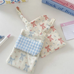 Floral nurse pouch with bow design, snap closure and portable strap for stationery