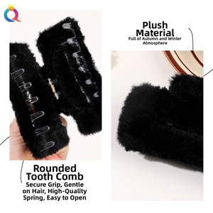 Detail view of large black plush hair claw clip with soft texture and strong inner teeth