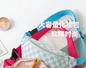 Close-up of checkered waist bags with adjustable straps showing spacious inner lining