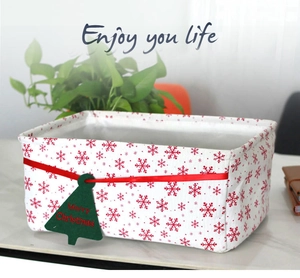 Detail view of Oxford cloth Christmas storage basket with snowflake pattern and gift tag