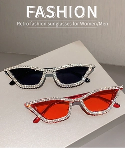 Close-up of sparkling rhinestones on vintage cat-eye sunglasses in black and red