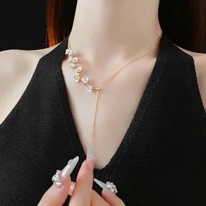 Gold plated flower pearl necklace with diamonds on elegant long adjustable chain