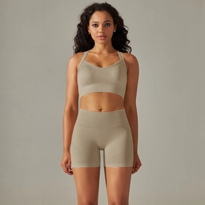Close-up of seamless ribbed high-waist fitness shorts and bra in earthy khaki tones