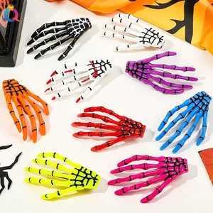 Detail shot of eight colorful skeleton hand hair clips with black spider web patterns
