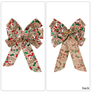 Detail of burlap Merry Christmas bows showing front and back views with gold twist ties