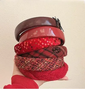 Collection of six red hairbands in leather, tweed, knit, and sequin styles for women