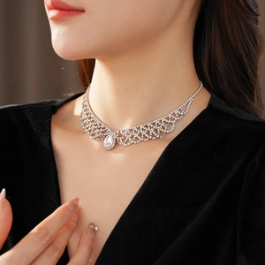 Close-up of elegant teardrop silver pendant necklace with sparkling diamond rhinestones