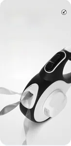 Detail of retractable dog leash featuring U-shaped anti-tangle exit and integrated LED light
