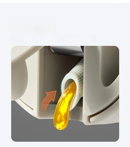 Detail view of the auto-suction oil dispenser spout showing the anti-drip return flow