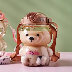 Cute bear-shaped plastic water bottle with straw, carry strap and Smile lettering
