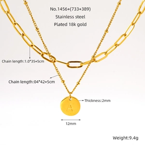 Detailed view of dual-layer stainless steel necklace with 18k gold plated letter A pendant
