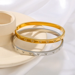 Elegant stainless steel heart bangles in gold and silver set with pavé cubic zirconia