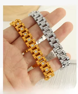 Close-up of gold and silver watch-style bracelets with sparkling white cubic zirconia